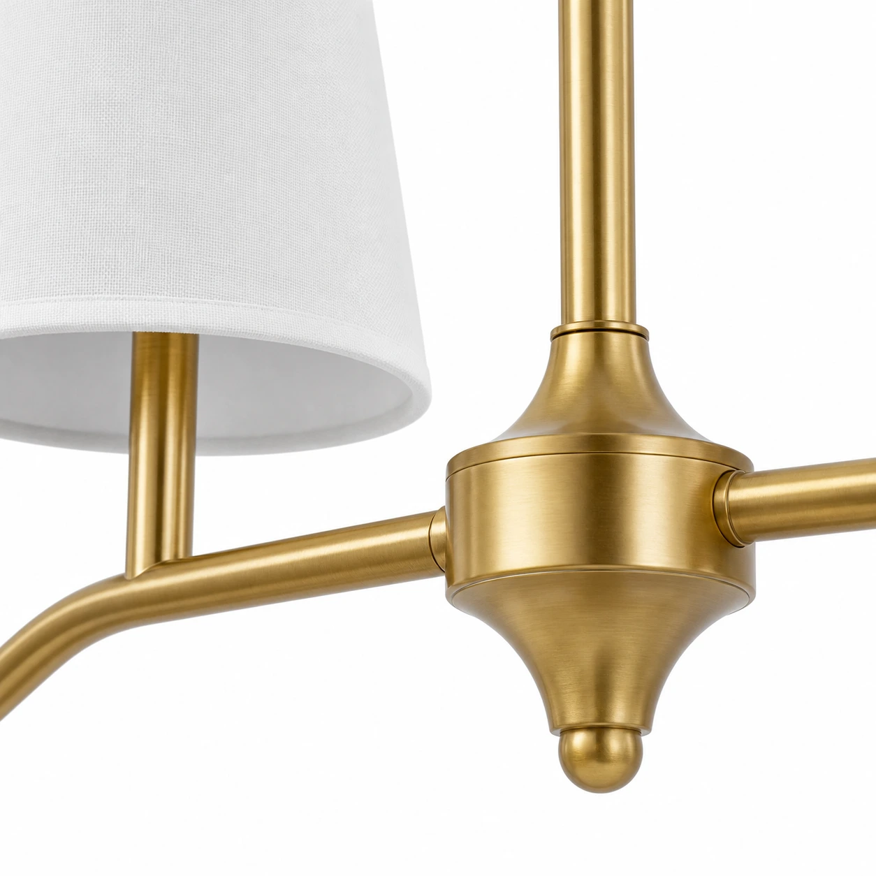 Brass finish detail with white fabric shade and branch arm